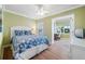 Inviting bedroom featuring a cozy bed, with an adjacent seating area at 19417 Gulf Blvd # B-210, Indian Shores, FL 33785