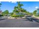 Well-maintained community entrance with lush landscaping and charming homes at 19417 Gulf Blvd # B-210, Indian Shores, FL 33785
