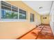 Image of the exterior walkway showcasing colorful paint and window access at 19417 Gulf Blvd # B-210, Indian Shores, FL 33785
