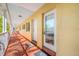 Hallway view with unit doors, offering easy access to residences and exterior amenities at 19417 Gulf Blvd # B-210, Indian Shores, FL 33785