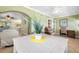Spacious living area with a dining table, comfortable seating, and bright natural light at 19417 Gulf Blvd # B-210, Indian Shores, FL 33785