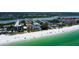 Breathtaking aerial view showcasing the condos, beachfront, and sparkling waters of the Gulf of Mexico at 19816 Gulf Boulevard # 201, Indian Shores, FL 33785