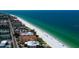 Stunning aerial view of beachfront condos along the Gulf Coast, with crystal-clear water and pristine sandy beaches at 19816 Gulf Boulevard # 201, Indian Shores, FL 33785