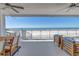 Relaxing balcony with ocean views, comfortable seating, and clear railings for unobstructed sight at 19816 Gulf Boulevard # 201, Indian Shores, FL 33785
