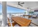 Large balcony featuring stunning ocean views, outdoor dining, and comfortable seating area at 19816 Gulf Boulevard # 201, Indian Shores, FL 33785