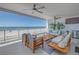 Bright and airy balcony featuring ocean views, stylish seating, and tropical plants at 19816 Gulf Boulevard # 201, Indian Shores, FL 33785