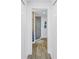 Modern bathroom features a glass enclosed shower with elegant tile work and wood-look flooring at 19816 Gulf Boulevard # 201, Indian Shores, FL 33785