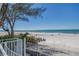 A picturesque view of a pristine white sand beach and tranquil ocean waters at 19816 Gulf Boulevard # 201, Indian Shores, FL 33785