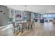 Bright dining room with ocean view, stylish décor, and open layout to living area at 19816 Gulf Boulevard # 201, Indian Shores, FL 33785