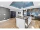 Modern kitchen featuring stainless steel appliances, an island with a sink, and pendant lighting at 19816 Gulf Boulevard # 201, Indian Shores, FL 33785