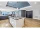 Kitchen with an island that has seating, that overlooks the dining and living spaces at 19816 Gulf Boulevard # 201, Indian Shores, FL 33785