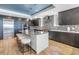 Stylish kitchen with a large island, bar seating, sleek cabinetry, and stainless steel appliances at 19816 Gulf Boulevard # 201, Indian Shores, FL 33785