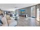 Modern living space with open floor plan with ocean view, stylish decor, and fireplace at 19816 Gulf Boulevard # 201, Indian Shores, FL 33785