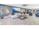 Open-concept living space featuring stylish furniture, modern lighting, and luxury tiled floors at 19816 Gulf Boulevard # 201, Indian Shores, FL 33785