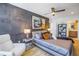Modern bedroom with unique accent wall, comfortable king-size bed, and designer furnishings at 19816 Gulf Boulevard # 201, Indian Shores, FL 33785