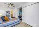 Bright bedroom with ample closet space and view through doorway to the en-suite bathroom at 19816 Gulf Boulevard # 201, Indian Shores, FL 33785