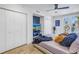 Comfortable bedroom with an exterior view through sliding glass doors and ample closet space at 19816 Gulf Boulevard # 201, Indian Shores, FL 33785
