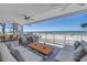 A beautifully designed outdoor patio with comfortable seating and stunning views of the ocean at 19816 Gulf Boulevard # 201, Indian Shores, FL 33785
