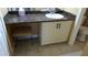 Bathroom featuring a vanity with under-cabinet seating and dark countertops at 2101 Fox Chase Blvd # 102, Palm Harbor, FL 34683