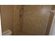 A bathroom shower stall featuring neutral tiles and chrome fixtures at 2101 Fox Chase Blvd # 102, Palm Harbor, FL 34683