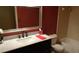 Bathroom featuring a marble vanity top, framed mirror, and a shower-tub combination at 2101 Fox Chase Blvd # 102, Palm Harbor, FL 34683