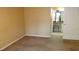 Bedroom with neutral carpet and walls, and a view into the bathroom at 2101 Fox Chase Blvd # 102, Palm Harbor, FL 34683