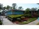 Community clubhouse featuring lush landscaping and a welcoming entrance at 2101 Fox Chase Blvd # 102, Palm Harbor, FL 34683