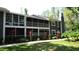Charming condo featuring a screened lanai, upper balcony, manicured landscaping and neutral paint scheme at 2101 Fox Chase Blvd # 102, Palm Harbor, FL 34683