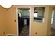 Kitchen features white cabinets and black appliances at 2101 Fox Chase Blvd # 102, Palm Harbor, FL 34683