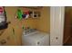 Laundry room featuring a washing machine, shelving and a neutral color scheme at 2101 Fox Chase Blvd # 102, Palm Harbor, FL 34683