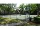 Community tennis courts secured with fencing, offering a recreational amenity for residents at 2101 Fox Chase Blvd # 102, Palm Harbor, FL 34683