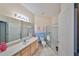 Bright bathroom featuring a glass-enclosed shower, light-colored walls, and a neutral-toned vanity with a clean, streamlined design at 2112 Acadia Greens Dr # 62, Sun City Center, FL 33573