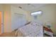 Charming bedroom with floral bedding, yellow walls, and matching bedside tables, creating a cozy and inviting space at 2112 Acadia Greens Dr # 62, Sun City Center, FL 33573