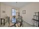 Formal dining room with modern chandelier and views to a window at 2112 Acadia Greens Dr # 62, Sun City Center, FL 33573