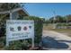 Exterior view of the Kings Point Garden Club with information and a picturesque setting at 2112 Acadia Greens Dr # 62, Sun City Center, FL 33573