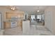 Open-concept kitchen offering ample natural light and seamless transition to the living area at 2112 Acadia Greens Dr # 62, Sun City Center, FL 33573