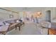 Comfortable living room featuring neutral tones, plush seating, and an open layout to the dining and kitchen areas at 2112 Acadia Greens Dr # 62, Sun City Center, FL 33573