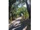 Scenic tree-lined path leading to a charming wooden bridge at 2112 Acadia Greens Dr # 62, Sun City Center, FL 33573