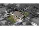 Aerial view of a home's surrounding neighborhood with a mature tree canopy and close proximity to a major thoroughfare at 2125 Acorn S Pl, St Petersburg, FL 33712