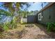 The backyard has a ring of bricks, foliage, and is partially fenced at 2125 Acorn S Pl, St Petersburg, FL 33712
