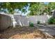 The backyard has a white fence, and grass at 2125 Acorn S Pl, St Petersburg, FL 33712
