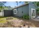 The backyard has a ring of bricks, foliage, and is partially fenced at 2125 Acorn S Pl, St Petersburg, FL 33712