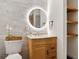 Modern bathroom boasts marble tile, a backlit mirror, and wooden shelving with a floating vanity at 2125 Acorn S Pl, St Petersburg, FL 33712