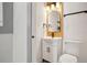 This bathroom features a sink with dark hardware and modern decor and tiled floor at 2125 Acorn S Pl, St Petersburg, FL 33712