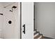 This bathroom features a walk-in shower with matte black hardware, and access to another room at 2125 Acorn S Pl, St Petersburg, FL 33712