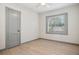 This bedroom has wood floors, white walls, and a window letting in natural light at 2125 Acorn S Pl, St Petersburg, FL 33712