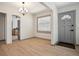 Bright dining room featuring modern light fixture, wood flooring, and gray accents at 2125 Acorn S Pl, St Petersburg, FL 33712