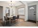 Inviting dining room with wood floors, modern lighting, and neutral colors, perfect for Gathering meals at 2125 Acorn S Pl, St Petersburg, FL 33712
