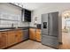 Kitchen featuring stainless steel appliances, wood cabinets, and a spacious layout at 2125 Acorn S Pl, St Petersburg, FL 33712