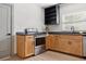 Kitchen featuring stainless steel appliances, wood cabinets, and granite countertops at 2125 Acorn S Pl, St Petersburg, FL 33712